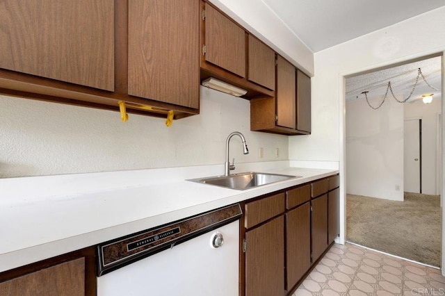 3213 Raintree Cir, Culver City, CA 90230 - kitchen featuring a sink, dishwasher, light countertops, light floors, and light carpet