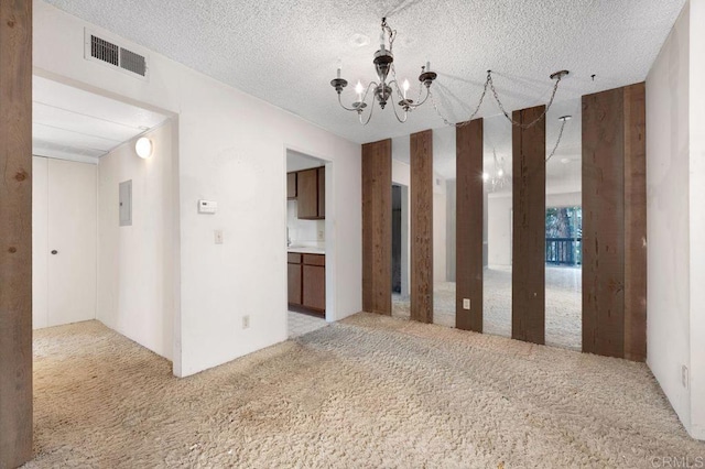 3213 Raintree Cir, Culver City, CA 90230 - unfurnished room with light carpet, a chandelier, and electric panel