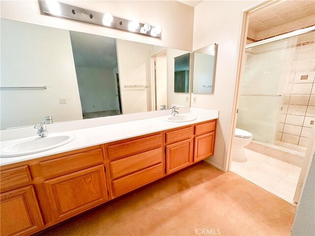 2868 Corte Caballos, Camarillo, CA 93010 - bathroom with a stall shower, double vanity, and toilet