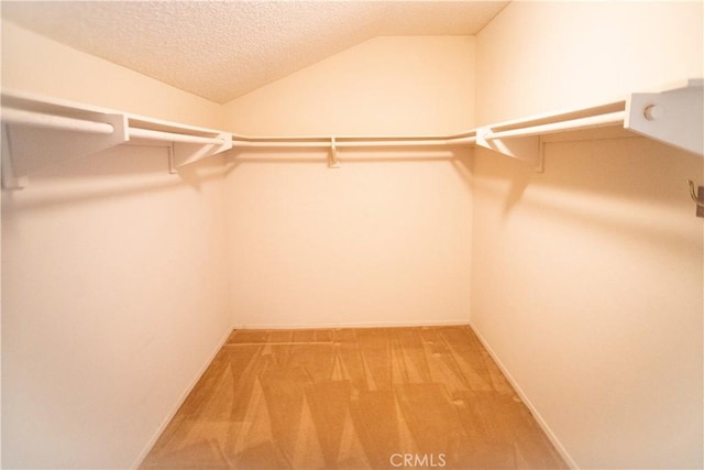 2868 Corte Caballos, Camarillo, CA 93010 - walk in closet featuring light colored carpet and lofted ceiling