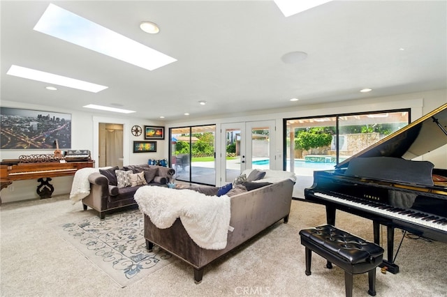 342 Canyon View Dr, Calimesa, CA 92320 - living room with plenty of natural light, light colored carpet, a skylight, french doors, and recessed lighting