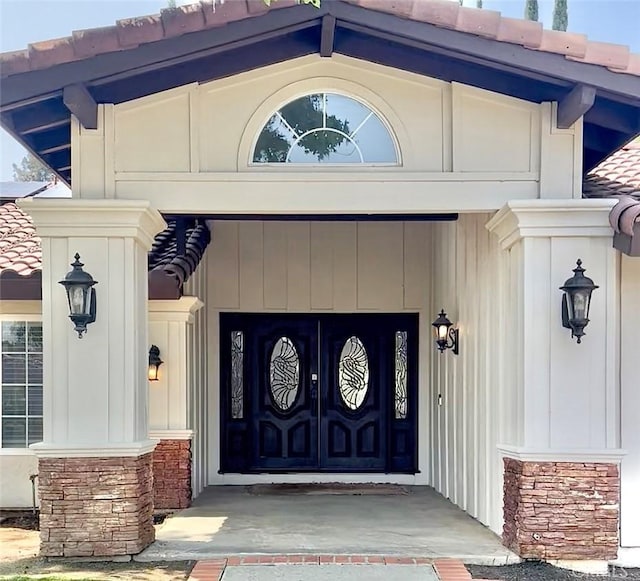 342 Canyon View Dr, Calimesa, CA 92320 - doorway to property featuring a tile roof, covered porch, and stone siding