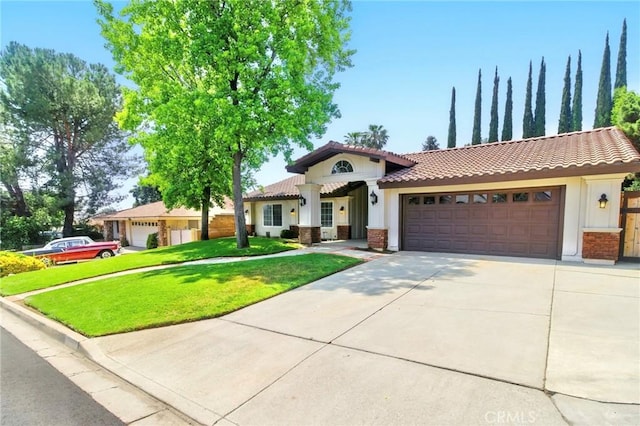 342 Canyon View Dr, Calimesa, CA 92320 - view of front facade featuring a tile roof, a garage, a front lawn, concrete driveway, and stucco siding