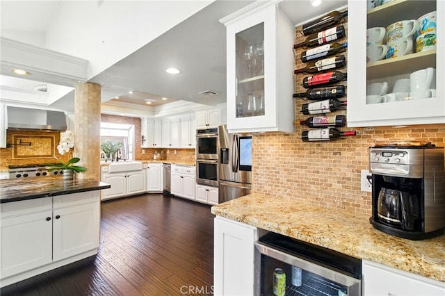 342 Canyon View Dr, Calimesa, CA 92320 - kitchen featuring a sink, white cabinetry, glass insert cabinets, decorative backsplash, and ornamental molding