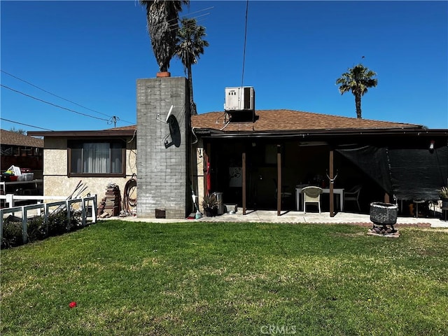 7887 Kempster Ave, Fontana, CA 92336 - back of house with a patio, a shingled roof, and a chimney