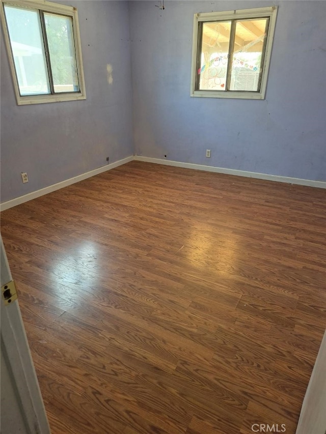 7887 Kempster Ave, Fontana, CA 92336 - unfurnished room featuring dark wood-type flooring