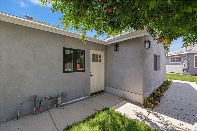 11012 Montgomery Ave, Granada Hills, CA 91344 - property entrance with stucco siding and a patio area