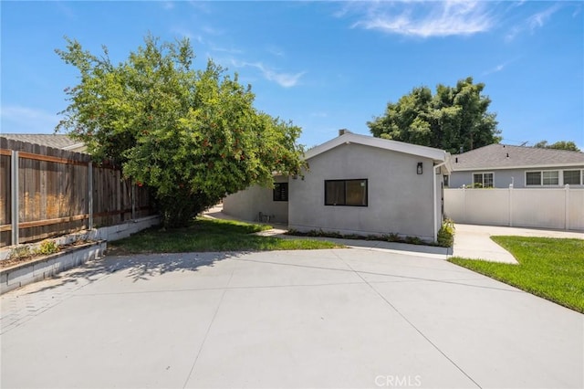 11012 Montgomery Ave, Granada Hills, CA 91344 - back of house featuring a patio and stucco siding