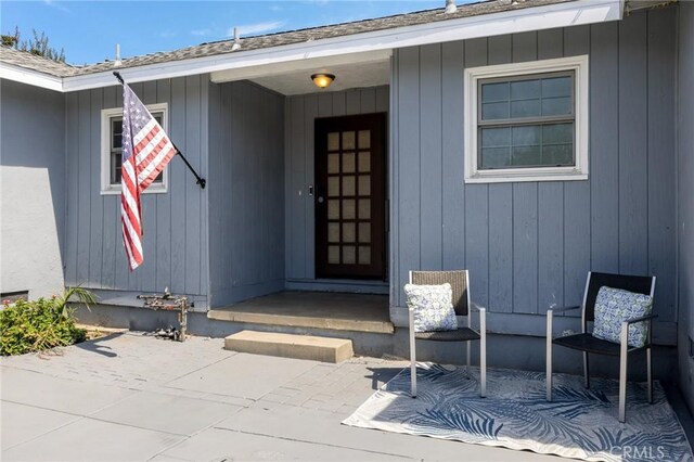 11012 Montgomery Ave, Granada Hills, CA 91344 - view of exterior entry with a patio