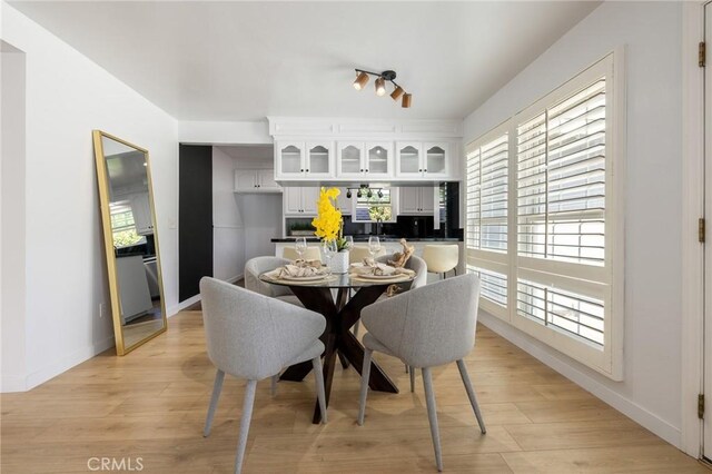 11012 Montgomery Ave, Granada Hills, CA 91344 - dining space featuring light wood-type flooring and baseboards