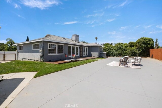 11012 Montgomery Ave, Granada Hills, CA 91344 - back of house with a patio, crawl space, stucco siding, and a chimney