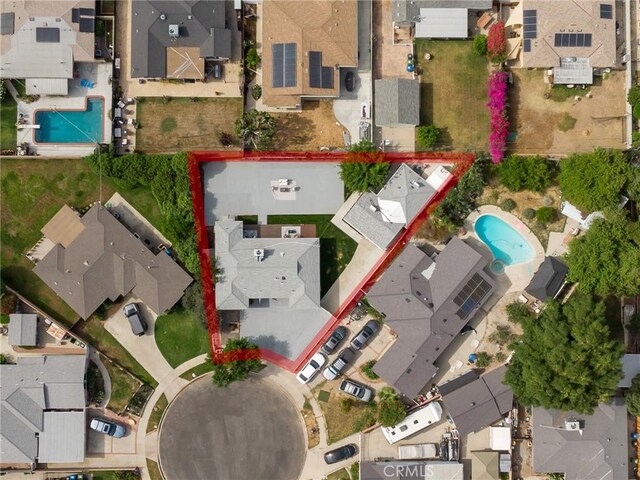 11012 Montgomery Ave, Granada Hills, CA 91344 - aerial view of residential area with a pool and property parcel outlined