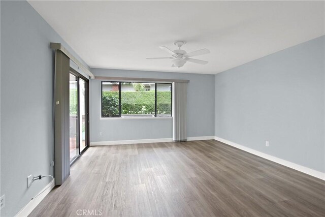 3520 Paseo Flamenco, San Clemente, CA 92672 - spare room with wood finished floors, a ceiling fan, and baseboards