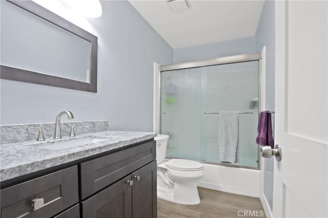 3520 Paseo Flamenco, San Clemente, CA 92672 - full bathroom featuring toilet, wood finished floors, vanity, and enclosed tub / shower combo