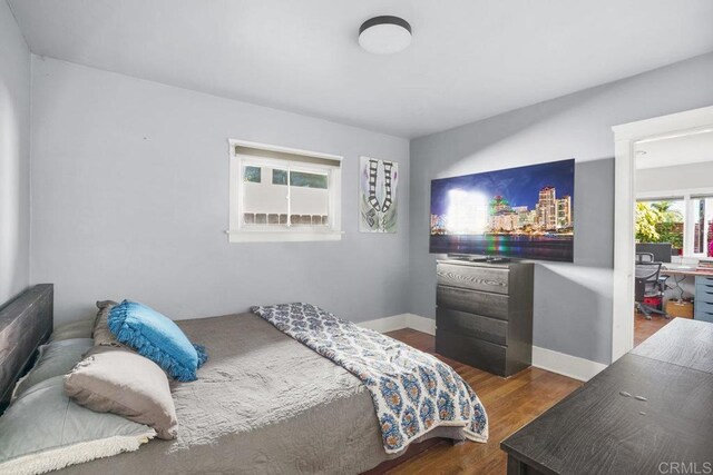 2211 Bancroft St, San Diego, CA 92104 - bedroom with dark wood finished floors and baseboards