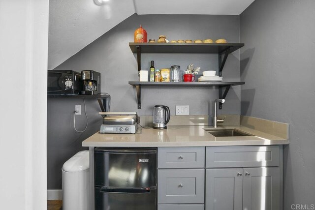 2211 Bancroft St, San Diego, CA 92104 - indoor wet bar with black appliances and lofted ceiling