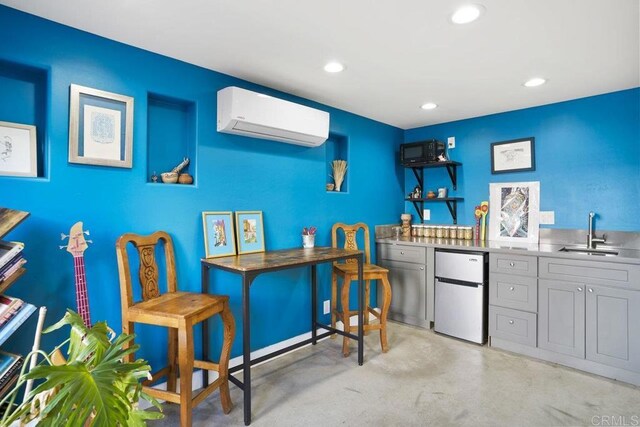 2211 Bancroft St, San Diego, CA 92104 - office area featuring a wall mounted air conditioner, recessed lighting, finished concrete floors, and bar area