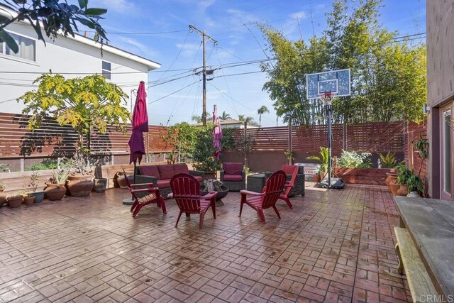 2211 Bancroft St, San Diego, CA 92104 - fenced backyard with a patio and outdoor lounge area