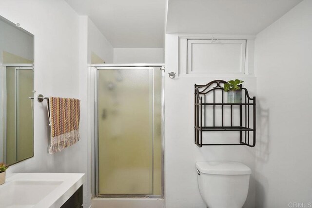 2211 Bancroft St, San Diego, CA 92104 - bathroom with vanity, a shower stall, and toilet