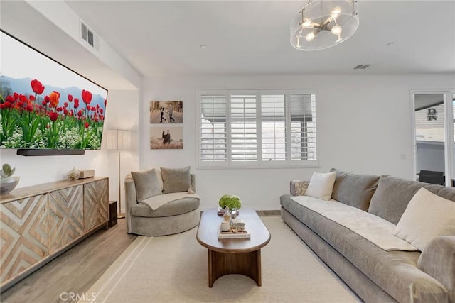 18026 Crabapple Ct, San Bernardino, CA 92407 - living area with a chandelier and wood finished floors