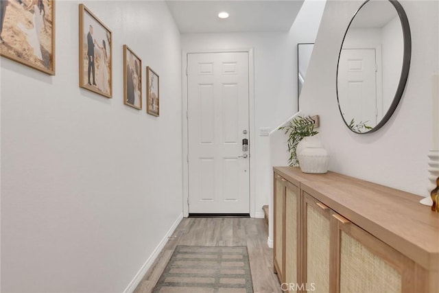 18026 Crabapple Ct, San Bernardino, CA 92407 - doorway to outside with light wood finished floors and recessed lighting