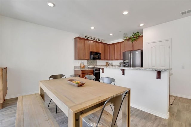 18026 Crabapple Ct, San Bernardino, CA 92407 - dining room with light wood-type flooring and recessed lighting