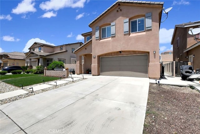 18026 Crabapple Ct, San Bernardino, CA 92407 - view of front of house featuring a garage, stucco siding, driveway, and a residential view