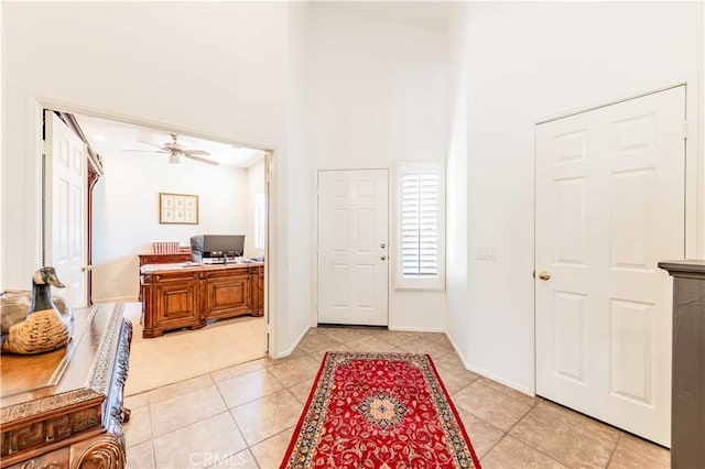 38260 Willow Ct, Murrieta, CA 92562 - entryway featuring a high ceiling, light tile patterned flooring, ceiling fan, and baseboards