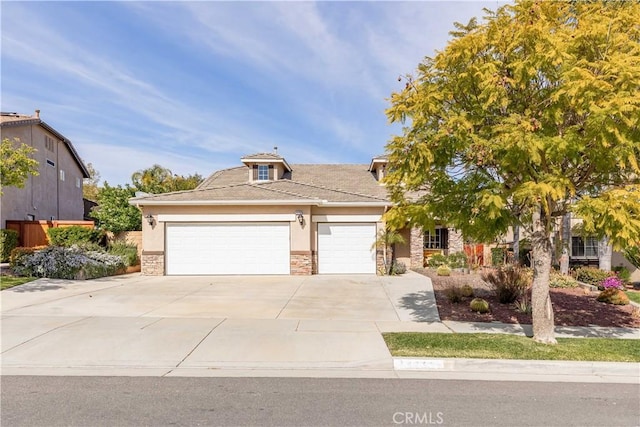 38260 Willow Ct, Murrieta, CA 92562 - view of front of property with an attached garage, stone siding, driveway, and stucco siding