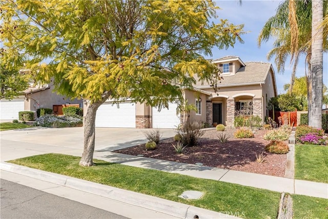 38260 Willow Ct, Murrieta, CA 92562 - view of front of property featuring stone siding, driveway, and stucco siding