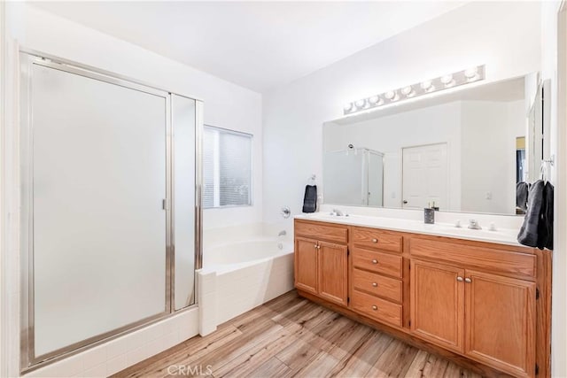 38260 Willow Ct, Murrieta, CA 92562 - full bathroom featuring a bath, a shower stall, double vanity, and wood finished floors