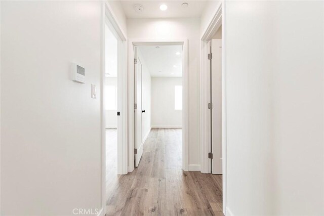 13934 Filmore St, Pacoima, CA 91331 - hallway with light wood-style floors and baseboards