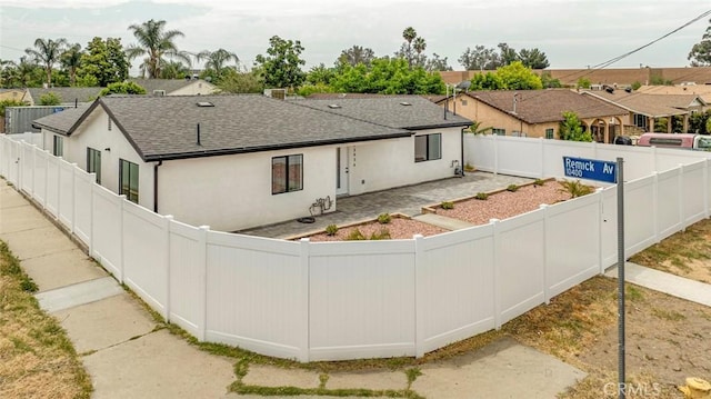 13934 Filmore St, Pacoima, CA 91331 - view of front of property with roof with shingles, stucco siding, a fenced backyard, and a residential view