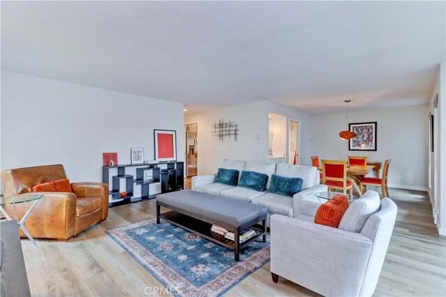 2032 E Bermuda St Unit 103, Long Beach, CA 90814 - living area with light wood-type flooring