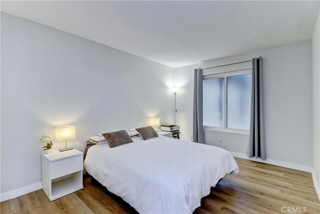 2032 E Bermuda St Unit 103, Long Beach, CA 90814 - bedroom featuring wood finished floors and baseboards