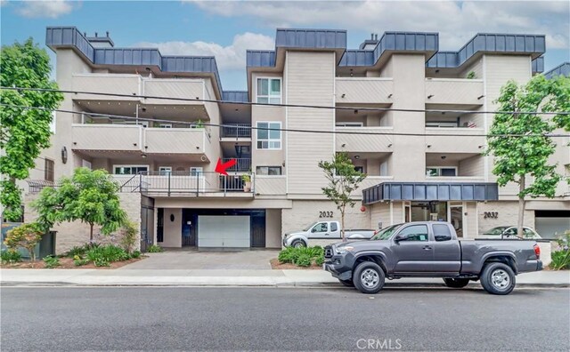 2032 E Bermuda St Unit 103, Long Beach, CA 90814 - view of apartment building / complex featuring a garage