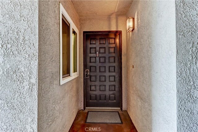 2032 E Bermuda St Unit 103, Long Beach, CA 90814 - doorway to property featuring stucco siding