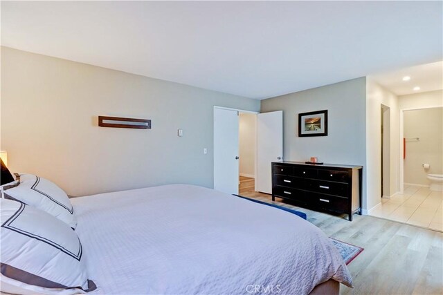 2032 E Bermuda St Unit 103, Long Beach, CA 90814 - bedroom featuring light wood-style floors, baseboards, ensuite bathroom, and recessed lighting