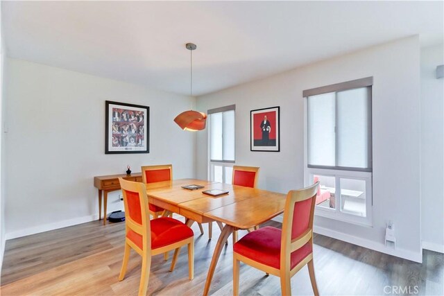 2032 E Bermuda St Unit 103, Long Beach, CA 90814 - dining area featuring light wood-type flooring and baseboards