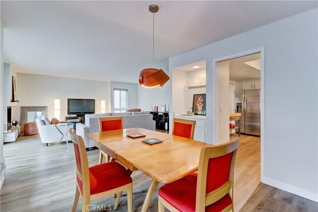 2032 E Bermuda St Unit 103, Long Beach, CA 90814 - dining space featuring light wood-style floors