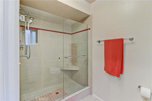 2032 E Bermuda St Unit 103, Long Beach, CA 90814 - bathroom with a shower stall, baseboards, and tile patterned flooring