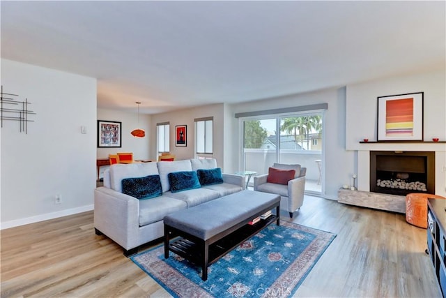 2032 E Bermuda St Unit 103, Long Beach, CA 90814 - living room with light wood-style floors and baseboards