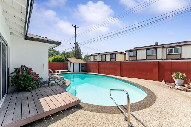 1315 E Wingate St, Covina, CA 91724 - view of pool featuring a fenced backyard, a storage shed, and a wooden deck
