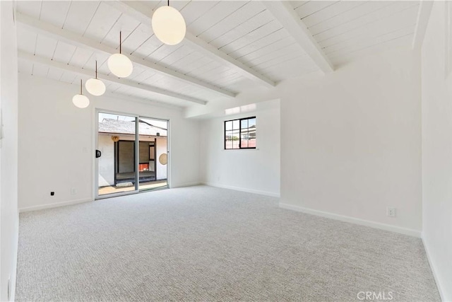 1315 E Wingate St, Covina, CA 91724 - carpeted empty room with baseboards and a wooden ceiling with exposed beams
