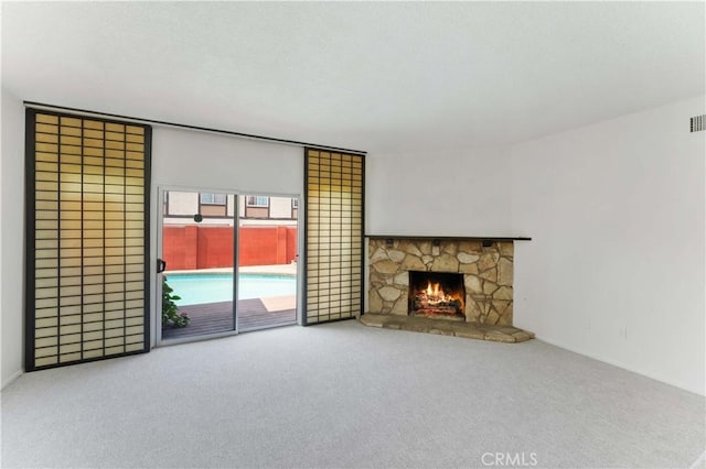 1315 E Wingate St, Covina, CA 91724 - unfurnished living room with carpet and a stone fireplace