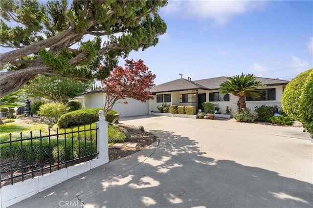 1315 E Wingate St, Covina, CA 91724 - ranch-style house featuring driveway, a garage, and stucco siding