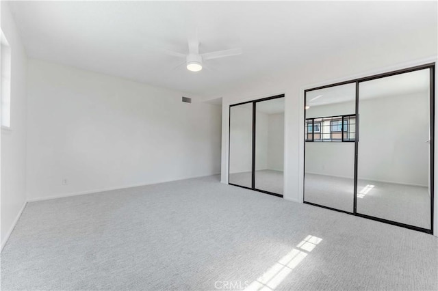 1315 E Wingate St, Covina, CA 91724 - unfurnished bedroom with two closets, carpet floors, and ceiling fan