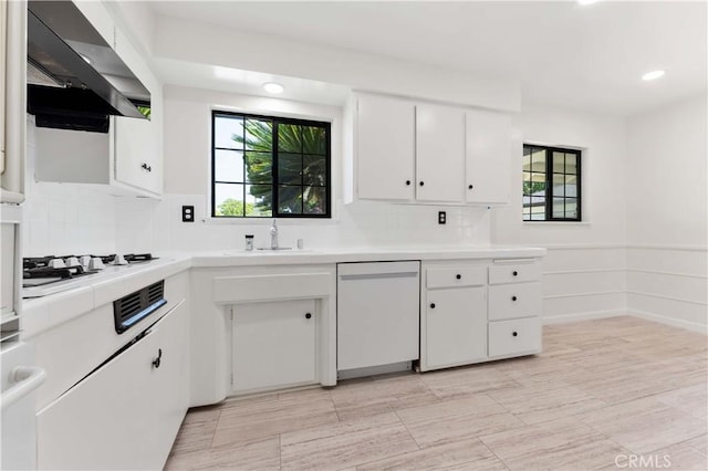1315 E Wingate St, Covina, CA 91724 - kitchen featuring wall chimney exhaust hood, white appliances, a sink, tile countertops, and white cabinetry
