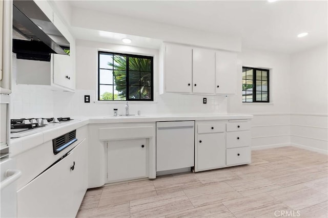 1315 E Wingate St, Covina, CA 91724 - kitchen featuring white appliances, ventilation hood, tile countertops, white cabinets, and plenty of natural light