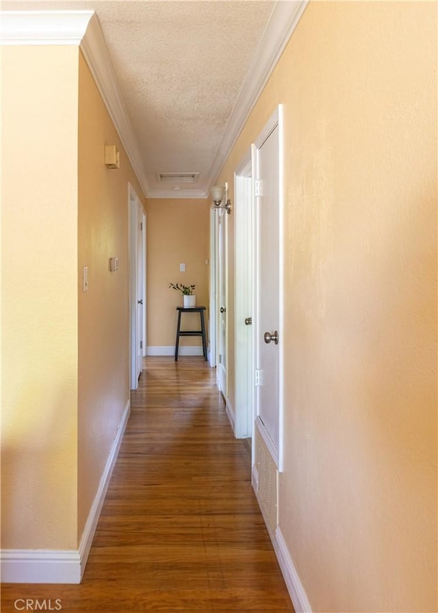 3158 Erie Ave, Merced, CA 95340 - hall with a textured ceiling, wood finished floors, and ornamental molding